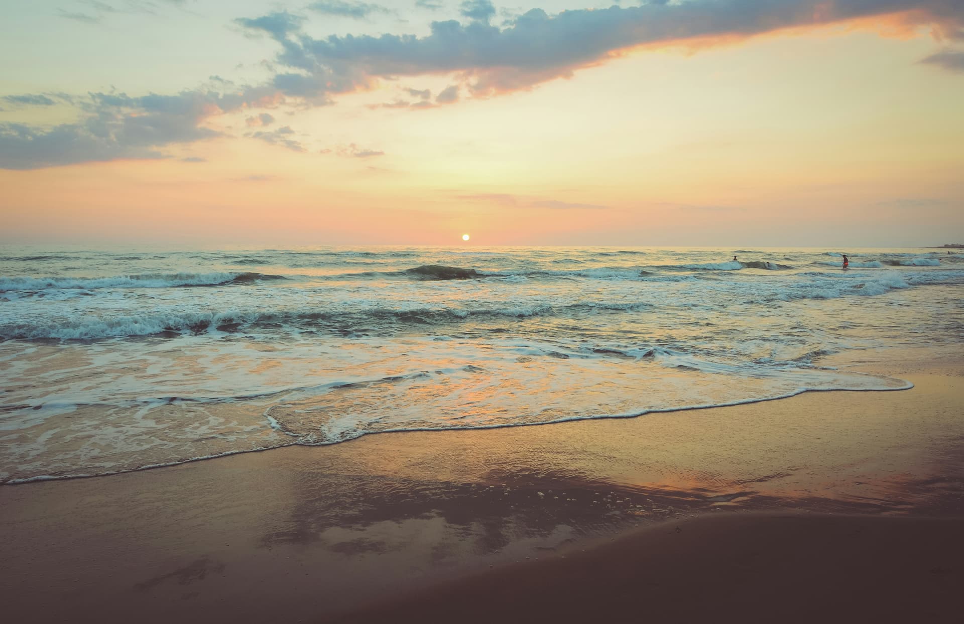 Footprints in the sand leading to a beachfront property