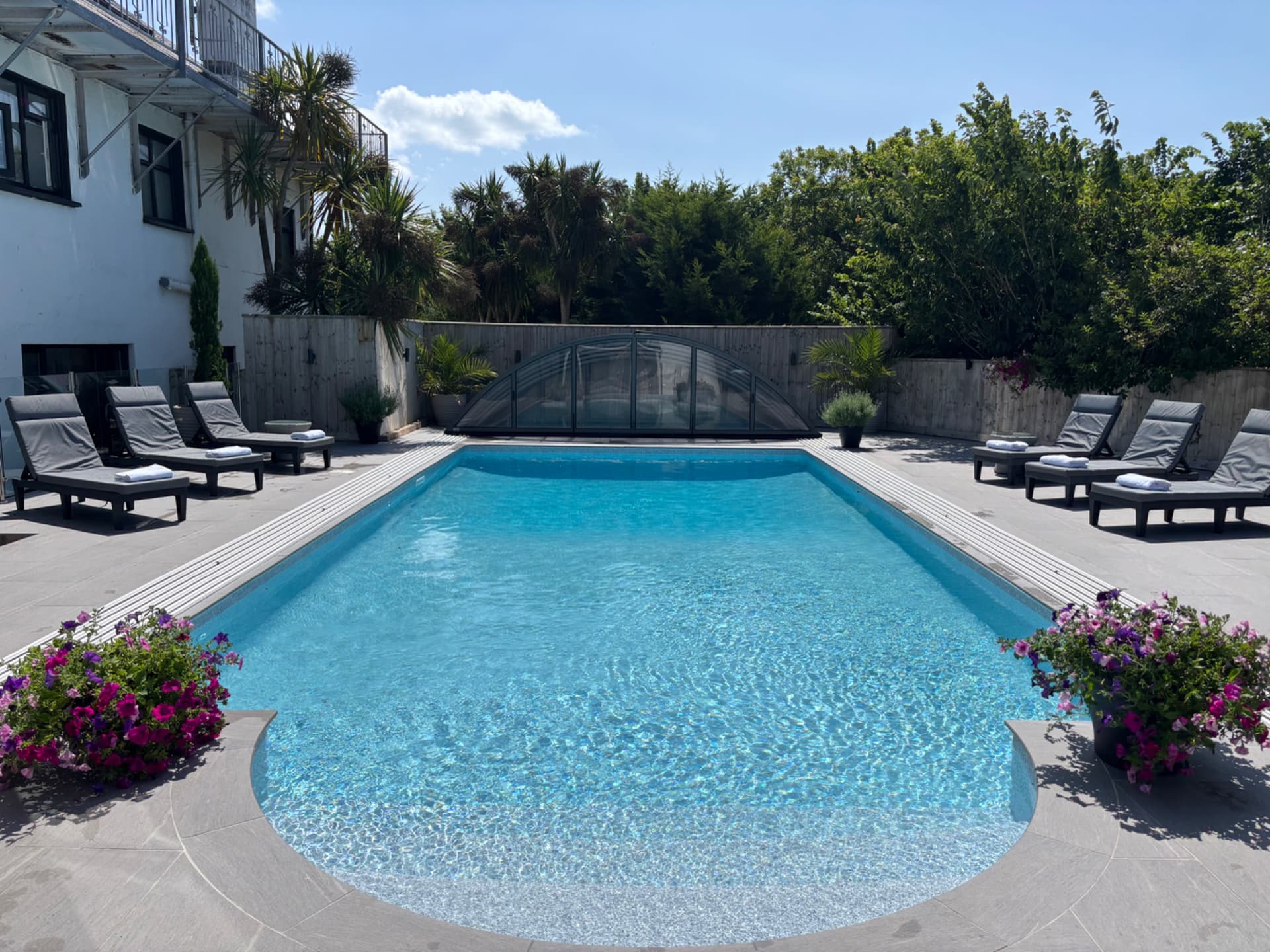 Trebrowen — Relax by the pool on comfortable loungers
